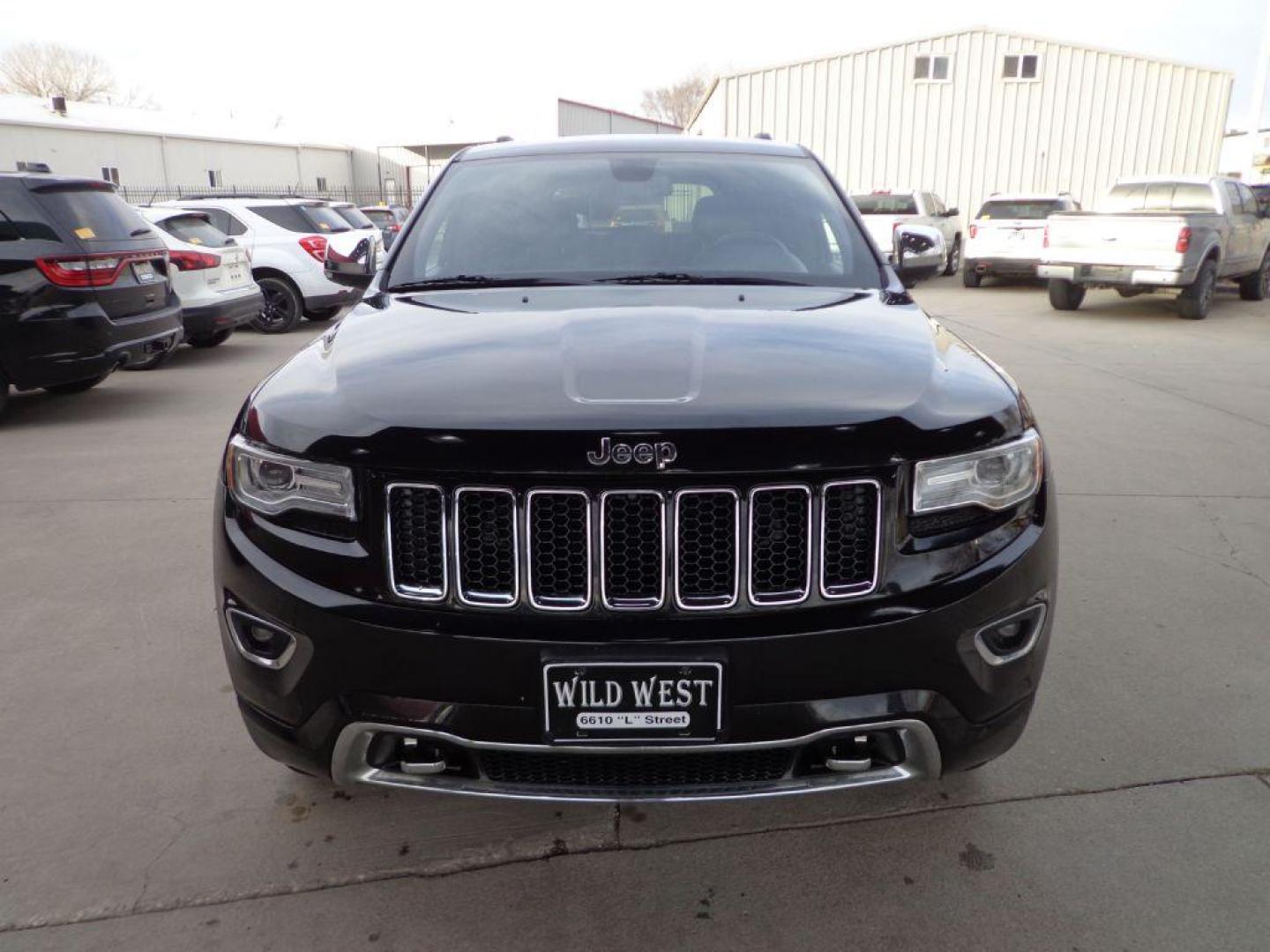 2014 BLACK JEEP GRAND CHEROKEE OVERLAND (1C4RJFCG1EC) with an 3.6L engine, Automatic transmission, located at 6610 L St., Omaha, NE, 68117, (402) 731-7800, 41.212872, -96.014702 - 2-OWNER, CLEAN CARFAX OVERLAND, PANORAMIC ROOF, NAV, HEATED FRONT/REAR SEATS, NEWER TIRES AND MUCH MORE! *****We have found that most customers do the majority of their shopping online before visiting a dealership. For this reason we feel it necessary to have a competitive price on our used ve - Photo#1