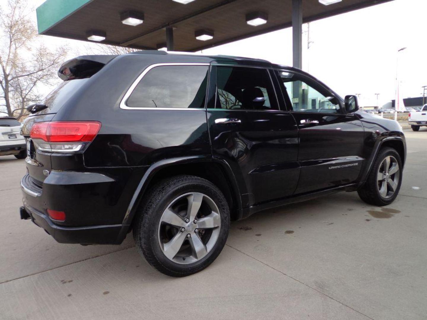2014 BLACK JEEP GRAND CHEROKEE OVERLAND (1C4RJFCG1EC) with an 3.6L engine, Automatic transmission, located at 6610 L St., Omaha, NE, 68117, (402) 731-7800, 41.212872, -96.014702 - 2-OWNER, CLEAN CARFAX OVERLAND, PANORAMIC ROOF, NAV, HEATED FRONT/REAR SEATS, NEWER TIRES AND MUCH MORE! *****We have found that most customers do the majority of their shopping online before visiting a dealership. For this reason we feel it necessary to have a competitive price on our used ve - Photo#3