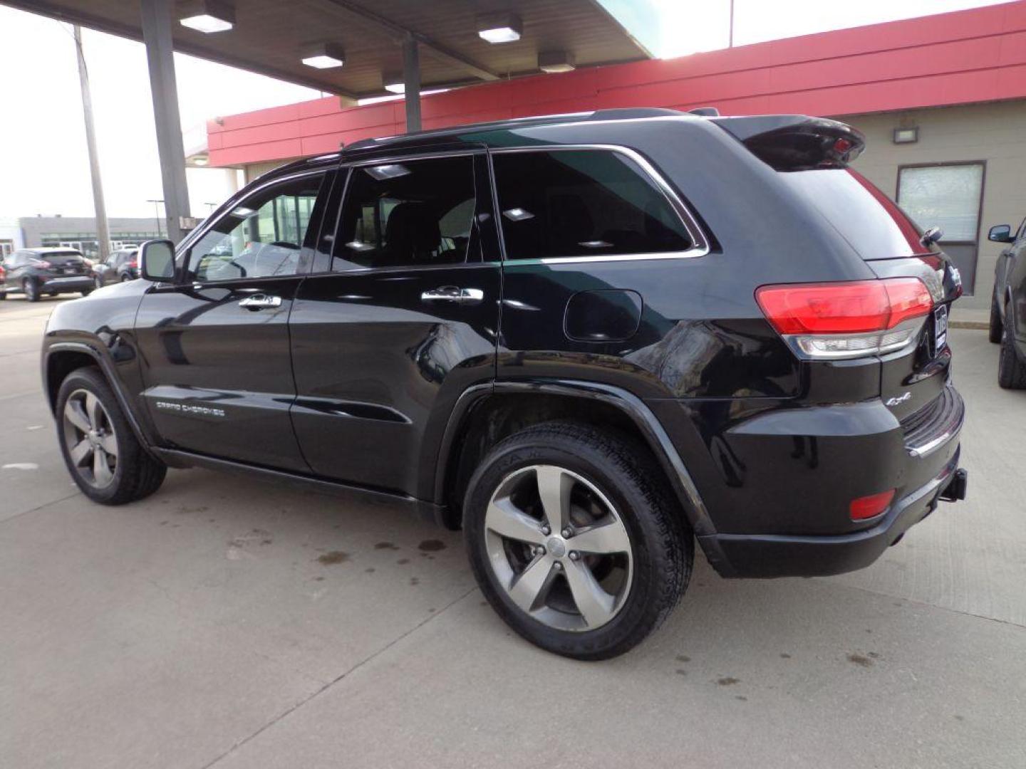 2014 BLACK JEEP GRAND CHEROKEE OVERLAND (1C4RJFCG1EC) with an 3.6L engine, Automatic transmission, located at 6610 L St., Omaha, NE, 68117, (402) 731-7800, 41.212872, -96.014702 - 2-OWNER, CLEAN CARFAX OVERLAND, PANORAMIC ROOF, NAV, HEATED FRONT/REAR SEATS, NEWER TIRES AND MUCH MORE! *****We have found that most customers do the majority of their shopping online before visiting a dealership. For this reason we feel it necessary to have a competitive price on our used ve - Photo#5