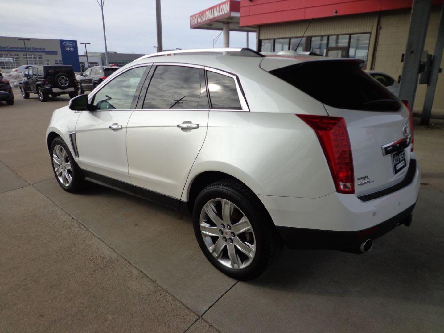 2015 WHITE CADILLAC SRX PERFORMANCE COLLECTION (3GYFNFE38FS) with an 3.6L engine, Automatic transmission, located at 6610 L St., Omaha, NE, 68117, (402) 731-7800, 41.212872, -96.014702 - THIS VEHICLE HAS A BEEN FULLY INSPECTED AND HAS A CLEAN TITLE WITH A FREE CARFAX REPORT PROVIDED! *****We have found that most customers do the majority of their shopping online before visiting a ealership. For this reason we feel it necessary to have a competitive price on our used vehicles rig - Photo#1