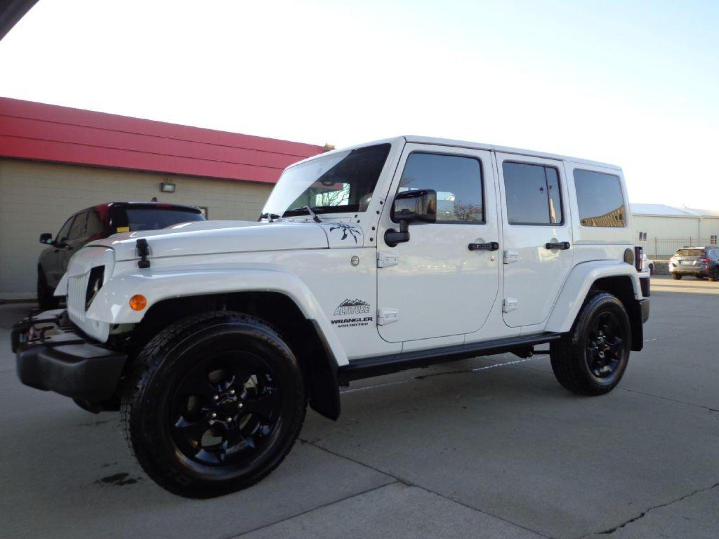 2015 WHITE JEEP WRANGLER UNLIMI SAHARA (1C4BJWEG9FL) with an 3.6L engine, Automatic transmission, located at 6610 L St., Omaha, NE, 68117, (402) 731-7800, 41.212872, -96.014702 - THIS VEHICLE HAS A BEEN FULLY INSPECTED AND HAS A CLEAN TITLE WITH A FREE CARFAX REPORT PROVIDED! 1-OWNER, CLEAN CARFAX, LOW MILEAGE, ALTITUDE PACKAGE WITH SOME NICE ADDED FEATURES AND NEWER TIRES! *****We have found that most customers do the majority of their shopping online before visiting a - Photo#0
