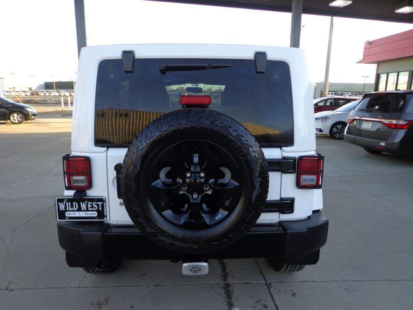 2015 WHITE JEEP WRANGLER UNLIMI SAHARA (1C4BJWEG9FL) with an 3.6L engine, Automatic transmission, located at 6610 L St., Omaha, NE, 68117, (402) 731-7800, 41.212872, -96.014702 - THIS VEHICLE HAS A BEEN FULLY INSPECTED AND HAS A CLEAN TITLE WITH A FREE CARFAX REPORT PROVIDED! 1-OWNER, CLEAN CARFAX, LOW MILEAGE, ALTITUDE PACKAGE WITH SOME NICE ADDED FEATURES AND NEWER TIRES! *****We have found that most customers do the majority of their shopping online before visiting a - Photo#4