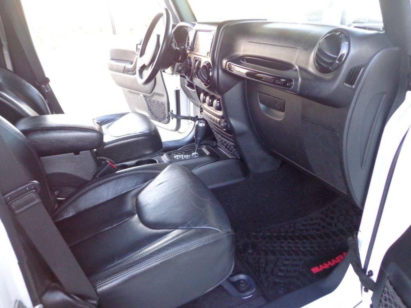 2015 WHITE JEEP WRANGLER UNLIMI SAHARA (1C4BJWEG9FL) with an 3.6L engine, Automatic transmission, located at 6610 L St., Omaha, NE, 68117, (402) 731-7800, 41.212872, -96.014702 - THIS VEHICLE HAS A BEEN FULLY INSPECTED AND HAS A CLEAN TITLE WITH A FREE CARFAX REPORT PROVIDED! 1-OWNER, CLEAN CARFAX, LOW MILEAGE, ALTITUDE PACKAGE WITH SOME NICE ADDED FEATURES AND NEWER TIRES! *****We have found that most customers do the majority of their shopping online before visiting a - Photo#17