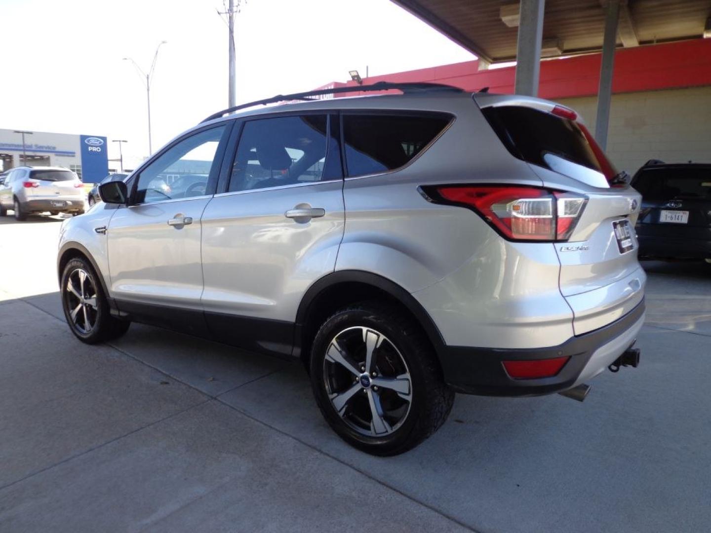 2018 SILVER FORD ESCAPE SEL (1FMCU9HD2JU) with an 1.5L engine, Automatic transmission, located at 6610 L St., Omaha, NE, 68117, (402) 731-7800, 41.212872, -96.014702 - THIS VEHICLE HAS A BEEN FULLY INSPECTED AND HAS A CLEAN TITLE WITH A FREE CARFAX REPORT PROVIDED! SHARP SEL WITH A CLEAN CARFAX, LOADED WITH PANORAMIC ROOF, NAV, FORD SAFE AND SMART PACKAGE INCLUDING, LANE KEEPING SYSTEM ,ADAPT CRUISE/COLLISION WARNING AND BLIS (BLIND SPOT INFO SYSTEM). ****- Photo#5