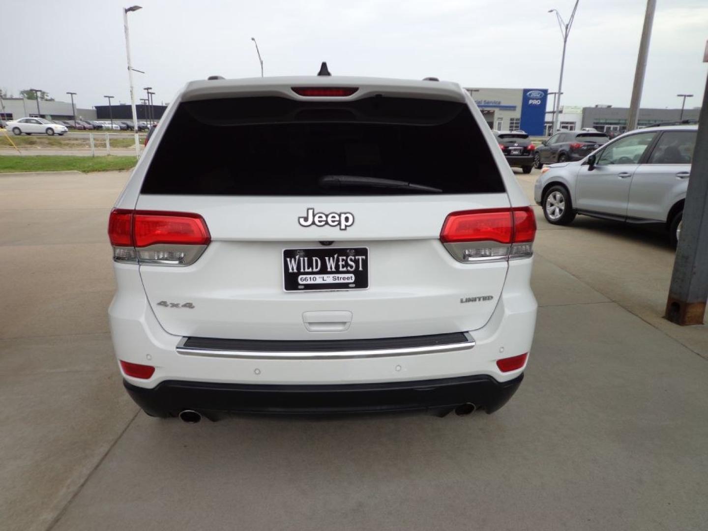 2014 WHITE JEEP GRAND CHEROKEE LIMITED (1C4RJFBG6EC) with an 3.6L engine, Automatic transmission, located at 6610 L St., Omaha, NE, 68117, (402) 731-7800, 41.212872, -96.014702 - THIS VEHICLE HAS A BEEN FULLY INSPECTED AND HAS A CLEAN TITLE WITH A FREE CARFAX REPORT PROVIDED! SHARP LOW MILE LIMITED LOADED WITH OPTIONS AND A NICE SET OF MICHELINS! *****We have found that most customers do the majority of their shopping online before visiting a ealership. For this reason- Photo#4