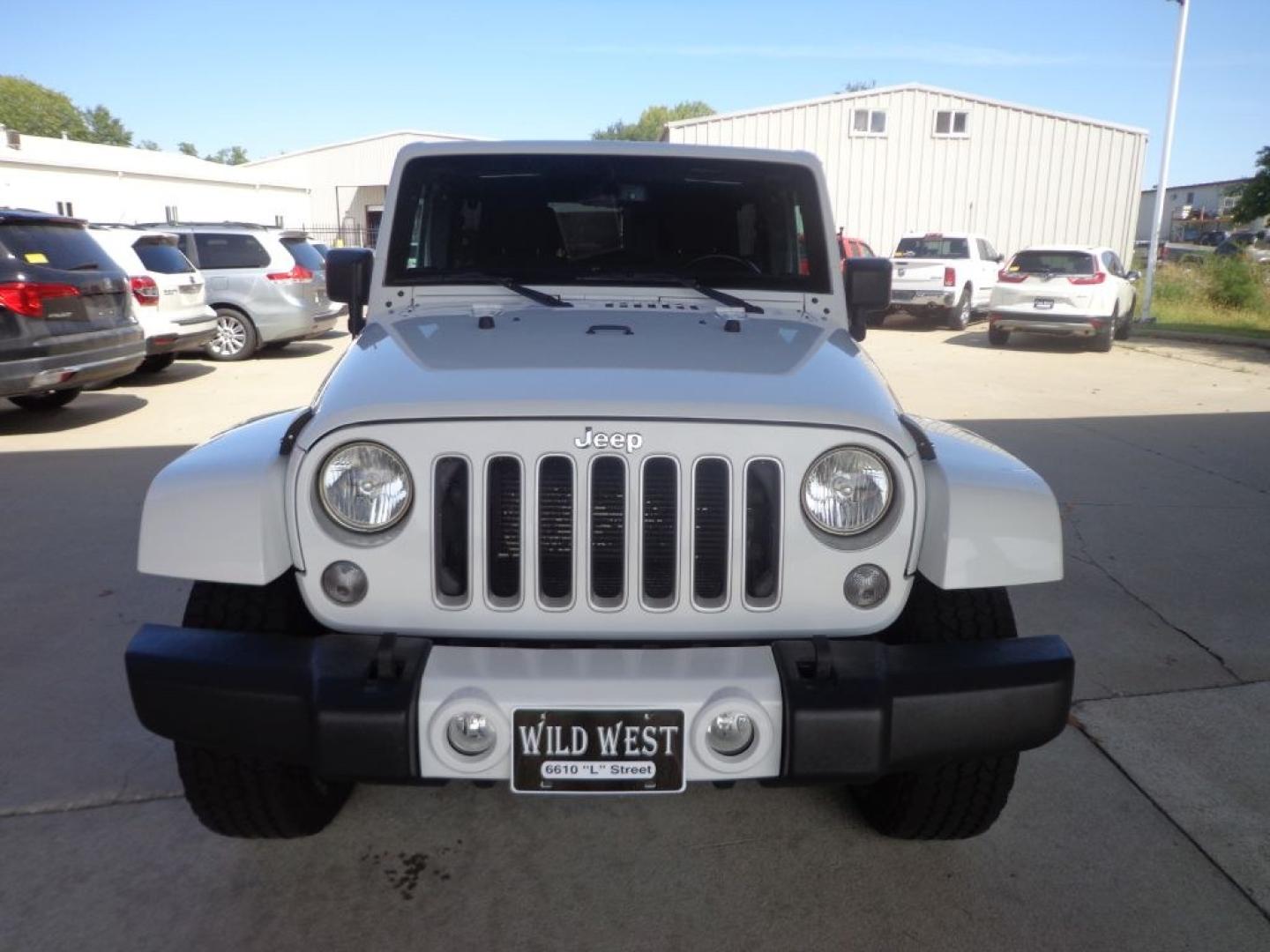 2016 WHITE JEEP WRANGLER UNLIMI SAHARA (1C4BJWEG6GL) with an 3.6L engine, Automatic transmission, located at 6610 L St., Omaha, NE, 68117, (402) 731-7800, 41.212872, -96.014702 - THIS VEHICLE HAS A BEEN FULLY INSPECTED AND HAS A CLEAN TITLE WITH A FREE CARFAX REPORT PROVIDED! *****We have found that most customers do the majority of their shopping online before visiting a ealership. For this reason we feel it necessary to have a competitive price on our used vehicles rig- Photo#1