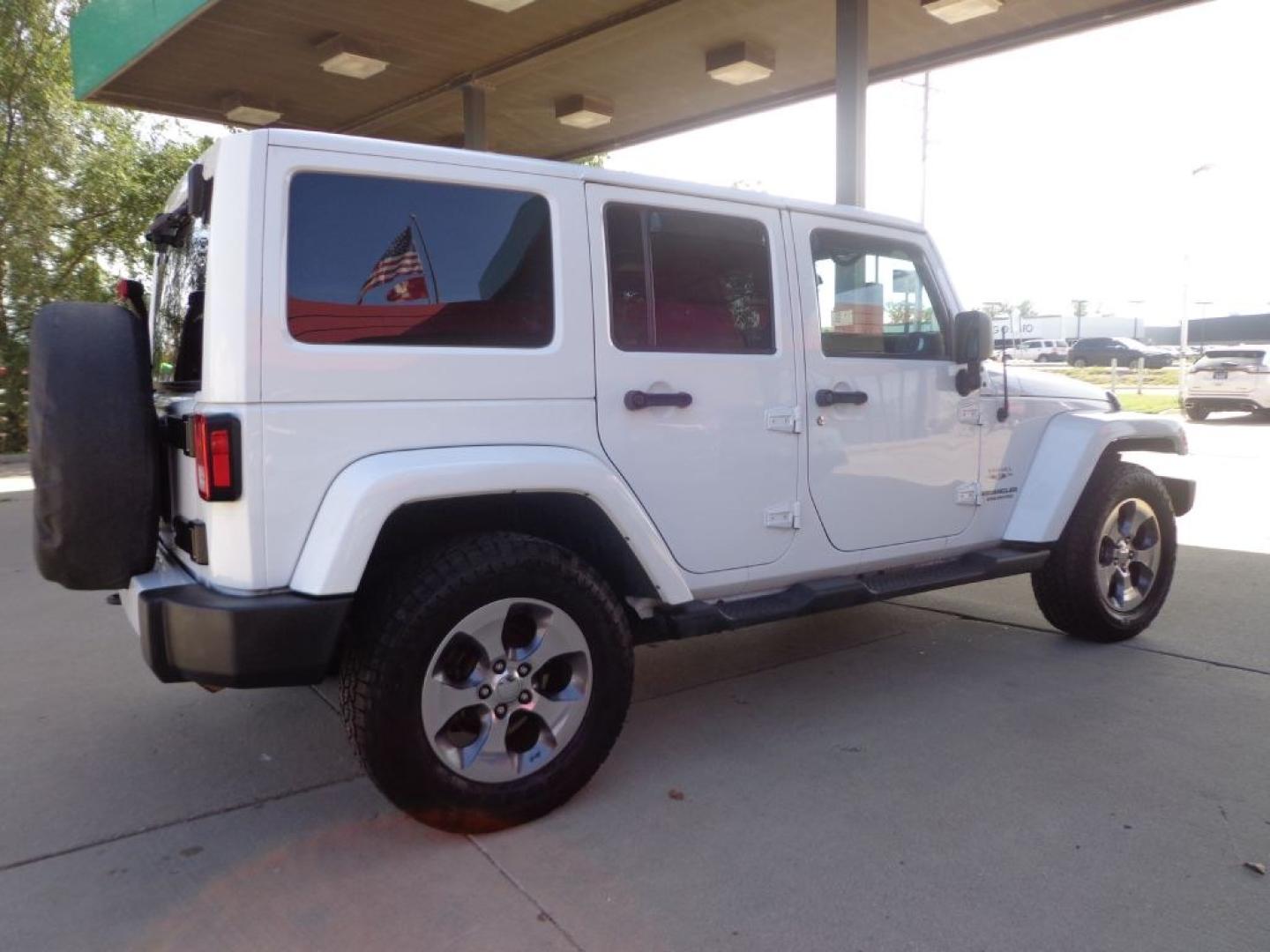 2016 WHITE JEEP WRANGLER UNLIMI SAHARA (1C4BJWEG6GL) with an 3.6L engine, Automatic transmission, located at 6610 L St., Omaha, NE, 68117, (402) 731-7800, 41.212872, -96.014702 - THIS VEHICLE HAS A BEEN FULLY INSPECTED AND HAS A CLEAN TITLE WITH A FREE CARFAX REPORT PROVIDED! *****We have found that most customers do the majority of their shopping online before visiting a ealership. For this reason we feel it necessary to have a competitive price on our used vehicles rig- Photo#3