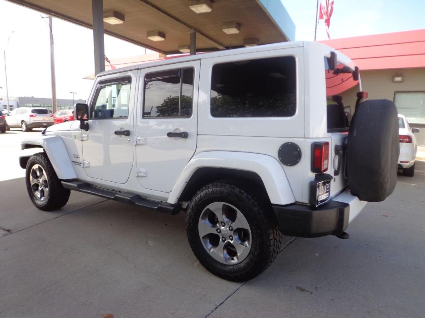 2016 WHITE JEEP WRANGLER UNLIMI SAHARA (1C4BJWEG6GL) with an 3.6L engine, Automatic transmission, located at 6610 L St., Omaha, NE, 68117, (402) 731-7800, 41.212872, -96.014702 - THIS VEHICLE HAS A BEEN FULLY INSPECTED AND HAS A CLEAN TITLE WITH A FREE CARFAX REPORT PROVIDED! *****We have found that most customers do the majority of their shopping online before visiting a ealership. For this reason we feel it necessary to have a competitive price on our used vehicles rig- Photo#5