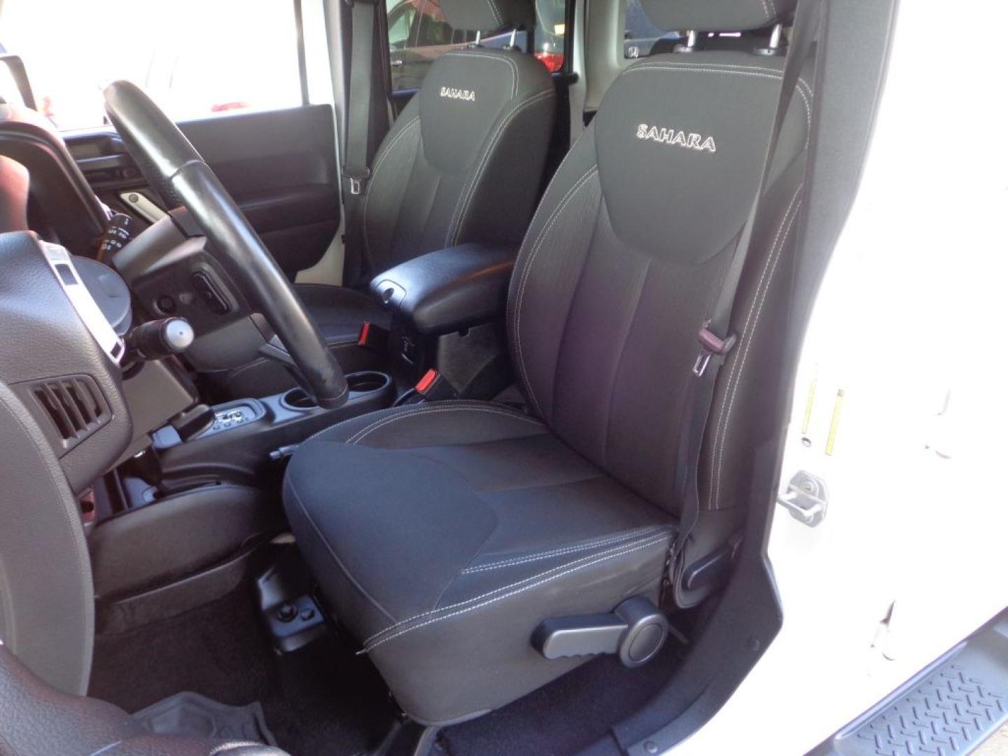 2016 WHITE JEEP WRANGLER UNLIMI SAHARA (1C4BJWEG6GL) with an 3.6L engine, Automatic transmission, located at 6610 L St., Omaha, NE, 68117, (402) 731-7800, 41.212872, -96.014702 - THIS VEHICLE HAS A BEEN FULLY INSPECTED AND HAS A CLEAN TITLE WITH A FREE CARFAX REPORT PROVIDED! *****We have found that most customers do the majority of their shopping online before visiting a ealership. For this reason we feel it necessary to have a competitive price on our used vehicles rig- Photo#9