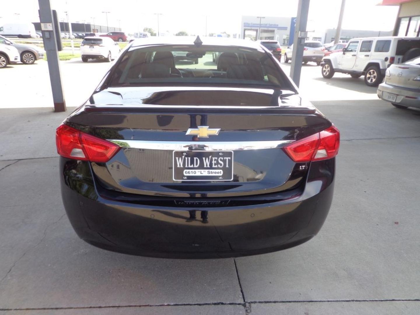 2014 BLACK CHEVROLET IMPALA LT (1G1125S31EU) with an 3.6L engine, Automatic transmission, located at 6610 L St., Omaha, NE, 68117, (402) 731-7800, 41.212872, -96.014702 - THIS VEHICLE HAS A BEEN FULLY INSPECTED AND HAS A CLEAN TITLE WITH A FREE CARFAX REPORT PROVIDED! SHARP. 1-OWNER, CLEAN CARFAX, LOW MILEAGE, SUNROOF, DRIVER ASSIST, HEATED LEATHER AND NEWER TIRES! *****We have found that most customers do the majority of their shopping online before visiting a- Photo#4