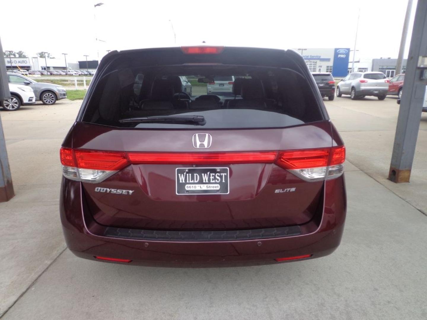 2014 MAROON HONDA ODYSSEY TOURING ELITE (5FNRL5H9XEB) with an 3.5L engine, Automatic transmission, located at 6610 L St., Omaha, NE, 68117, (402) 731-7800, 41.212872, -96.014702 - THIS VEHICLE HAS A BEEN FULLY INSPECTED AND HAS A CLEAN TITLE WITH A FREE CARFAX REPORT PROVIDED! 1-OWNER, CLEAN CARFAX, LOW MILEAGE, NAV, REAR ENTERTAINMENT AND NEWER TIRES! *****We have found that most customers do the majority of their shopping online before visiting a ealership. For this re- Photo#4